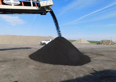 Mound of reclaimed asphalt pavement processed as part of the Cold Central Plant Recycling process.